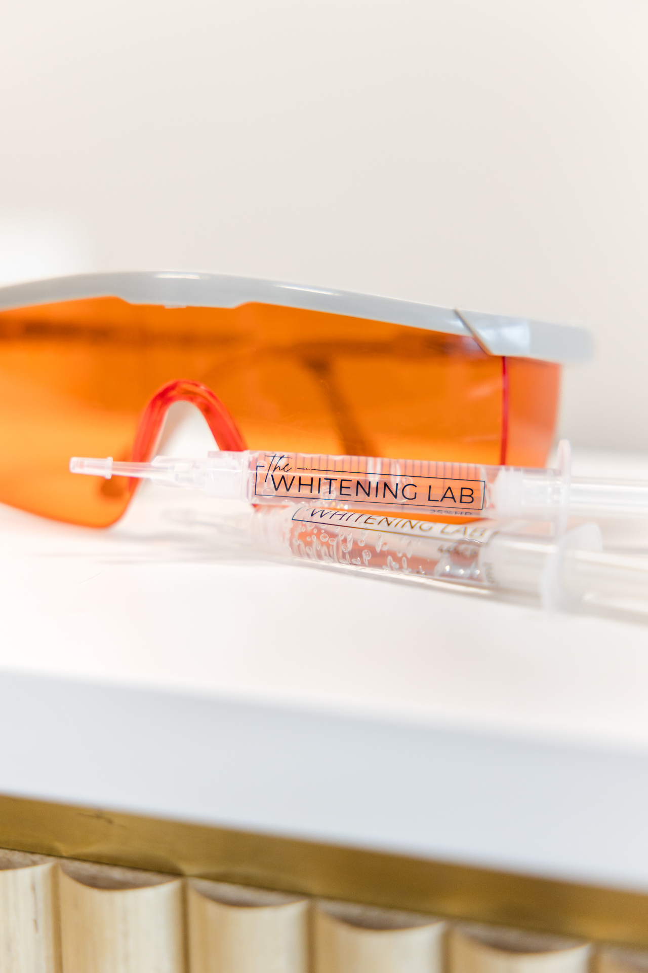 The Whitening Lab professional whitening gel syringes and protective eyewear